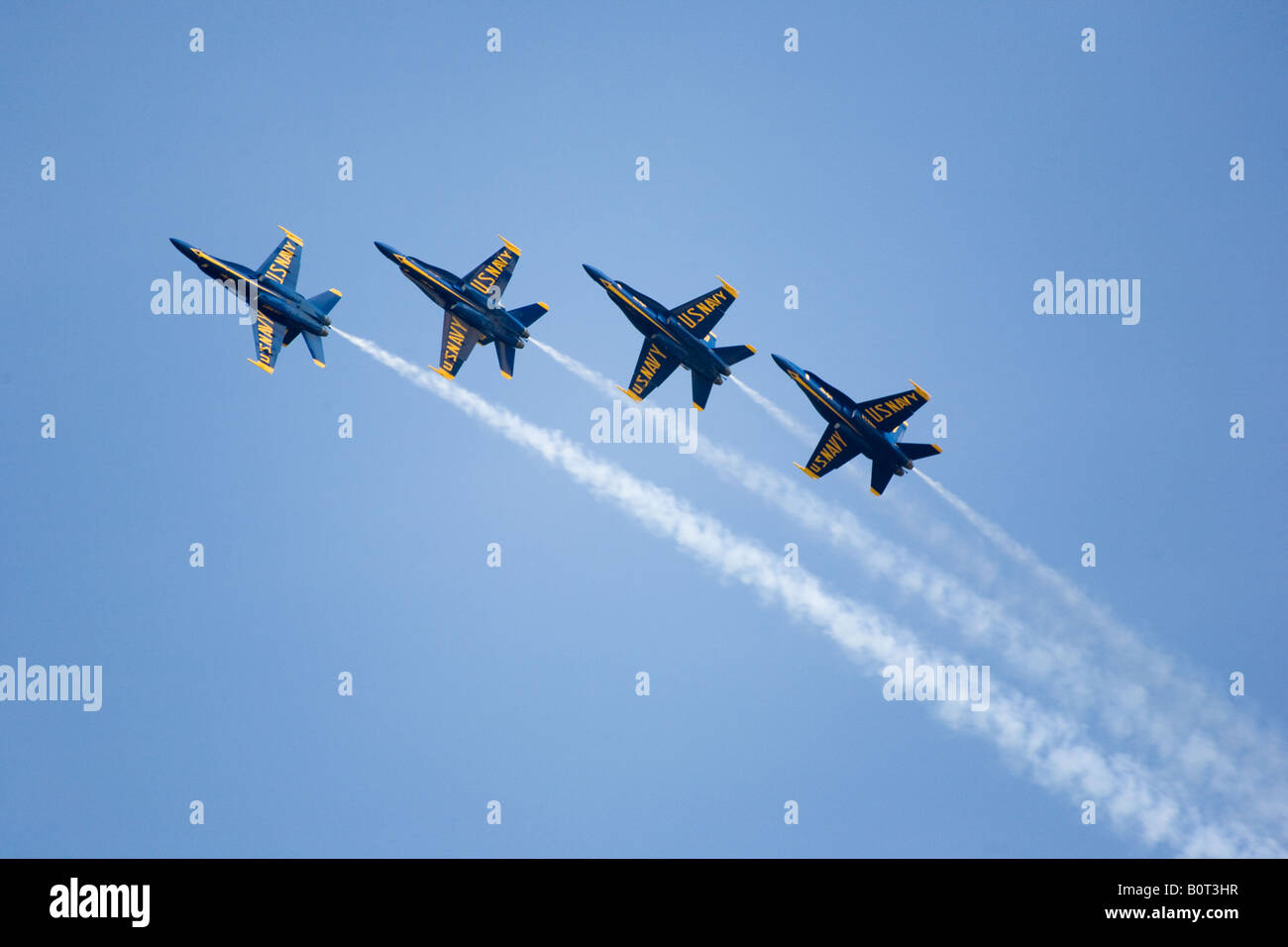 The elite U S Navy Blue Angels speed in formation at hundreds of miles per hour at the 2008 Joint Service Open House air show. Stock Photo
