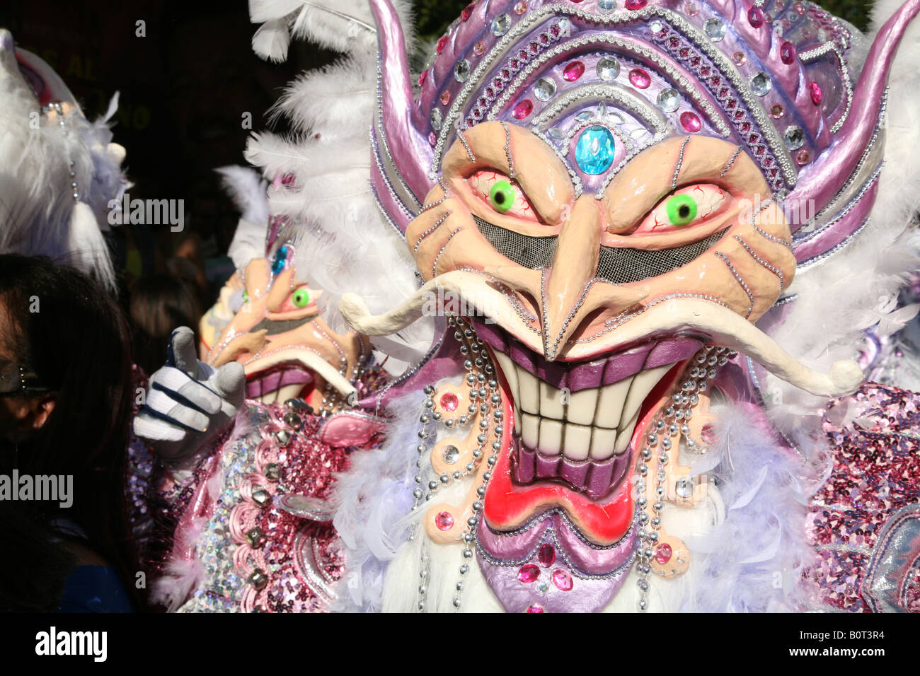 Carnival participants wearing fancy dress of Diablo Cojuelo perform