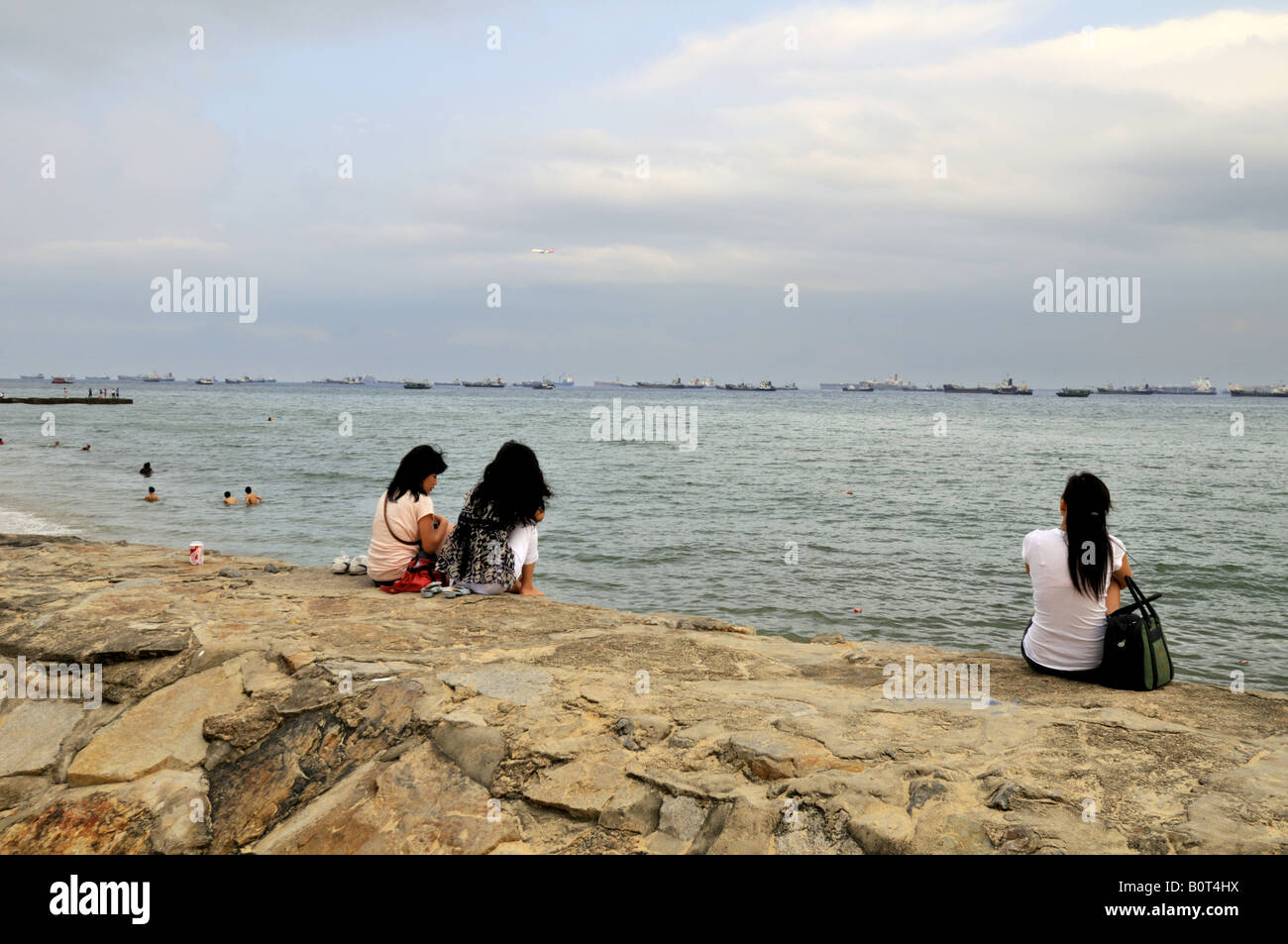 Many ships in the Singapore Strait can be seen from the East Coast Park of Singapore Stock Photo