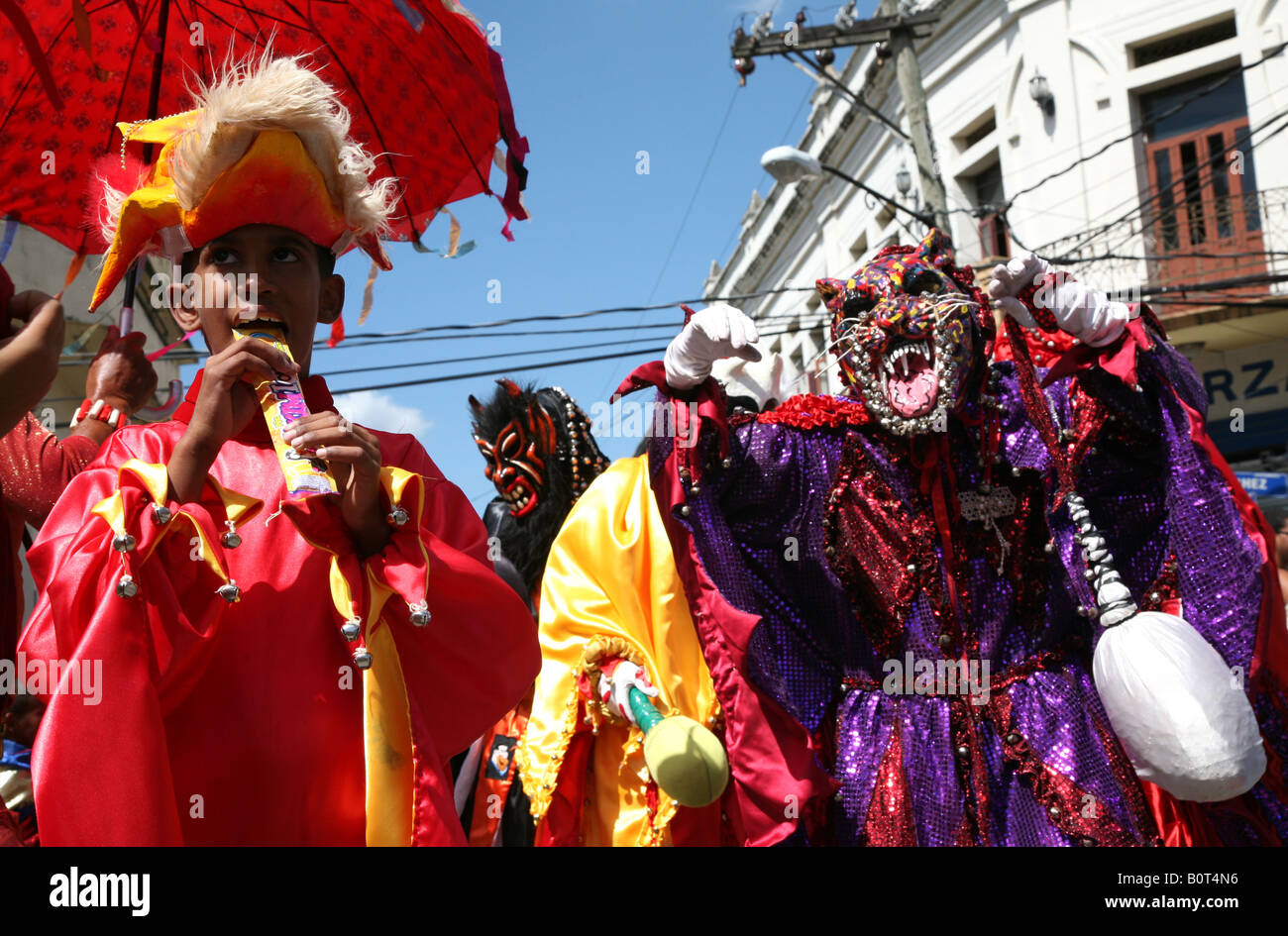 Carnival participants wearing fancy dress of Diablo Cojuelo perform