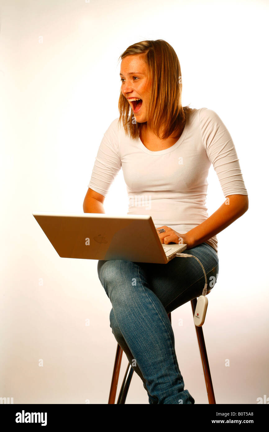 A young woman having a laugh on the Internet Stock Photo
