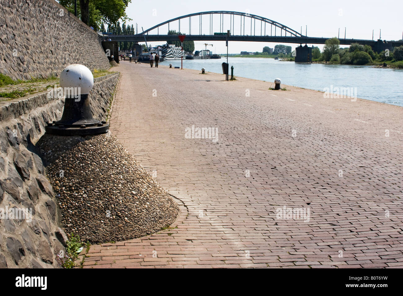 John Frost bridge crossing the river Rhine in Arnhem with mooring post in foreground. Stock Photo