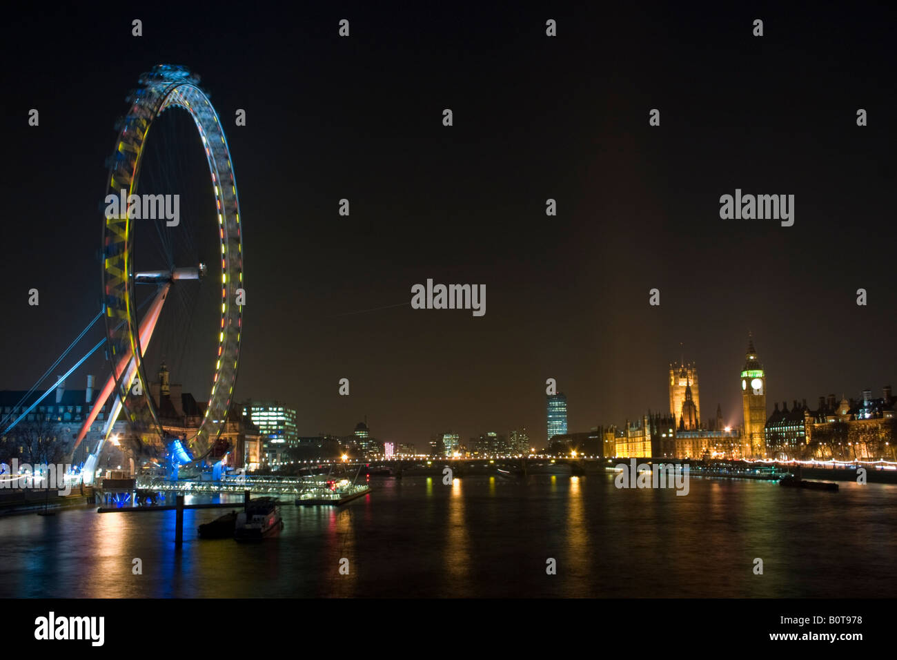 Night view of the London Eye Houses of Parliament and Big Ben from Hungerford Bridge Stock Photo