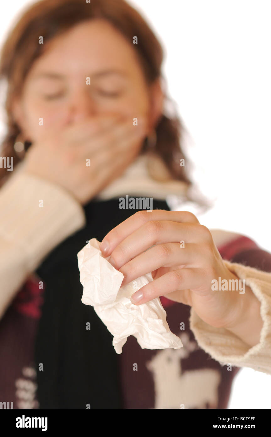 Young woman in thick sweater is suffering a cold Stock Photo