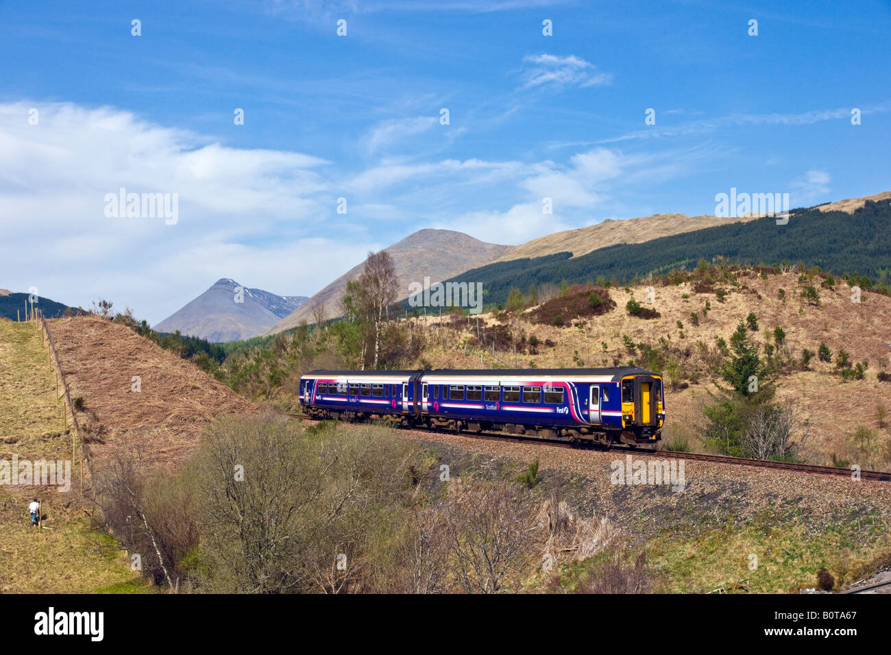 First Scotrail class 156 DMU travelling north towards Tyndrum near Cononish in Scottish West Highlands on its way to Oban. Stock Photo