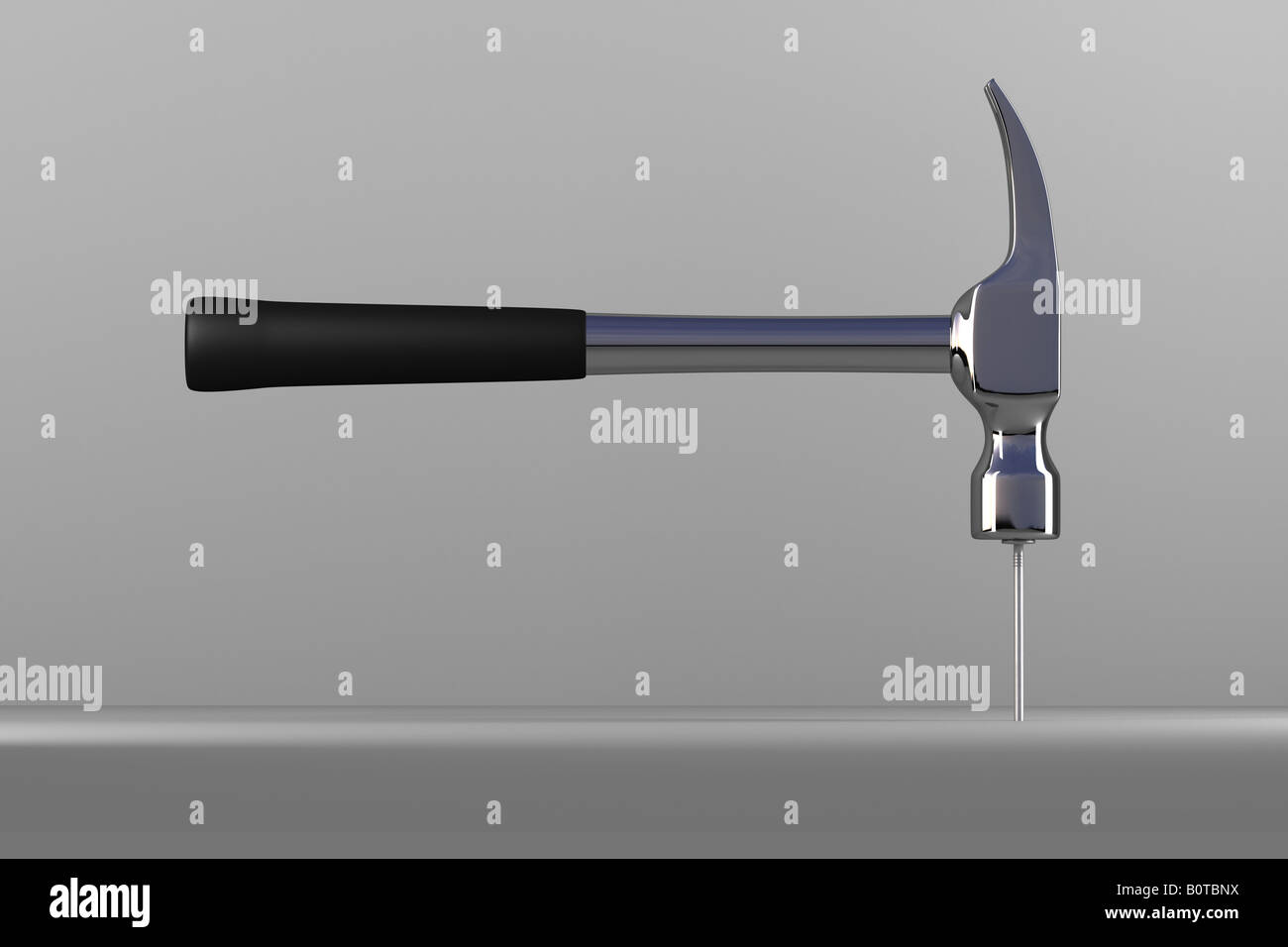 Hammer hitting a nail over gray background Stock Photo Alamy