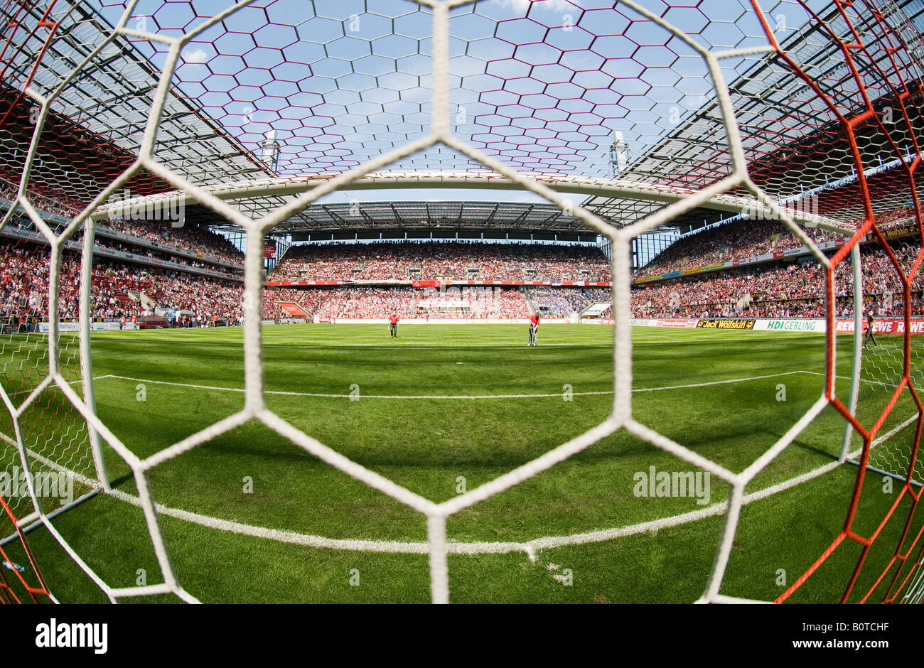 empty goal in filled football Stadium before kick-off Stock Photo