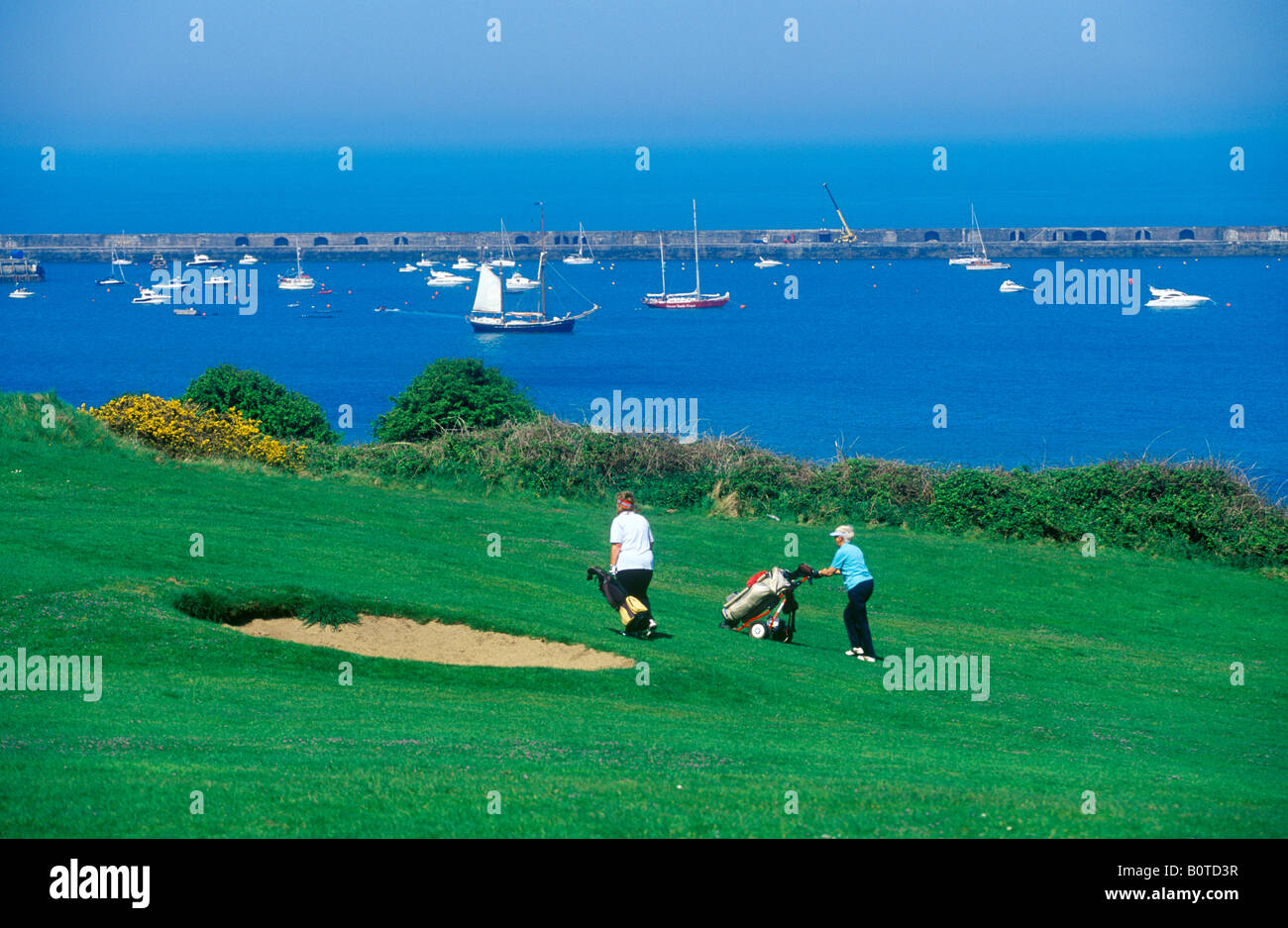 golf course and Braye Harbour, Alderney Island Stock Photo