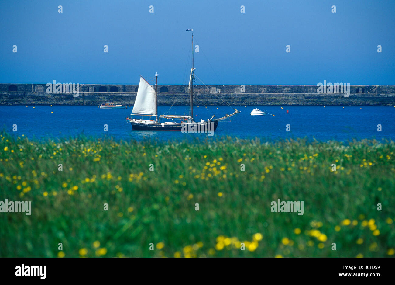 sailing ship at Braye Harbour, Alderney Island Stock Photo