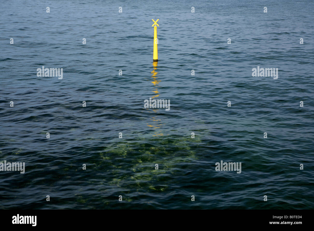 Partially submerged yellow navigation marker. Copenhagen, Denmark Stock