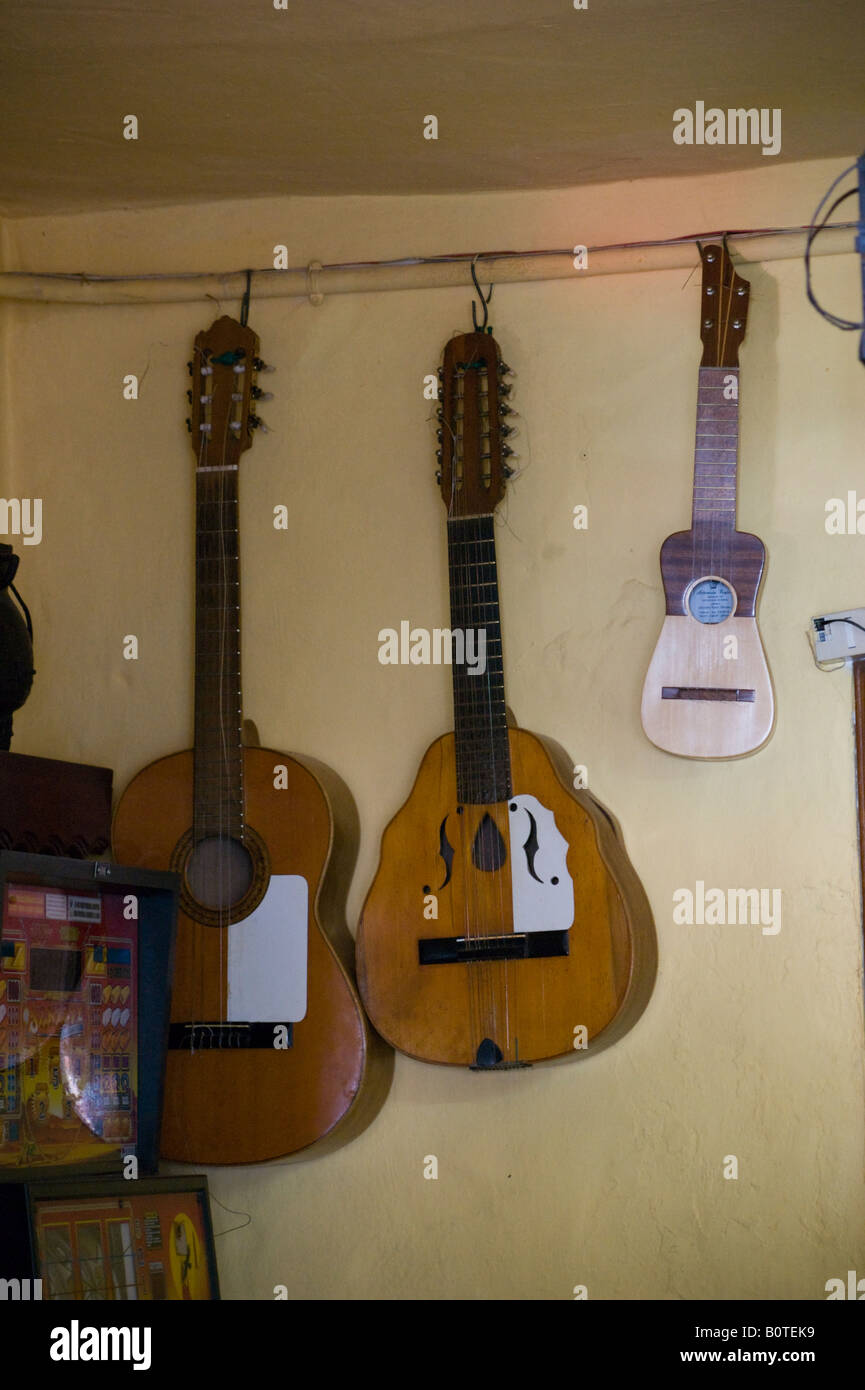Gran Canaria - in the mountain village of Fataga artist community, Caranian  instruments hanging in bar: guitarra laud and timple Stock Photo - Alamy