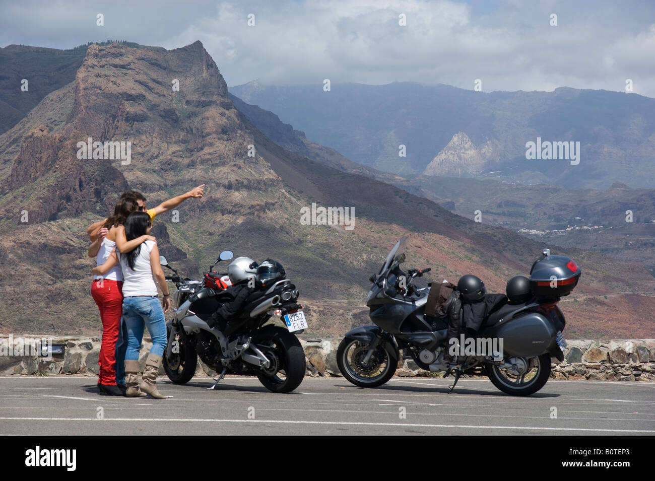 Motorbike riders stop to view Gran Canaria scenery Stock Photo