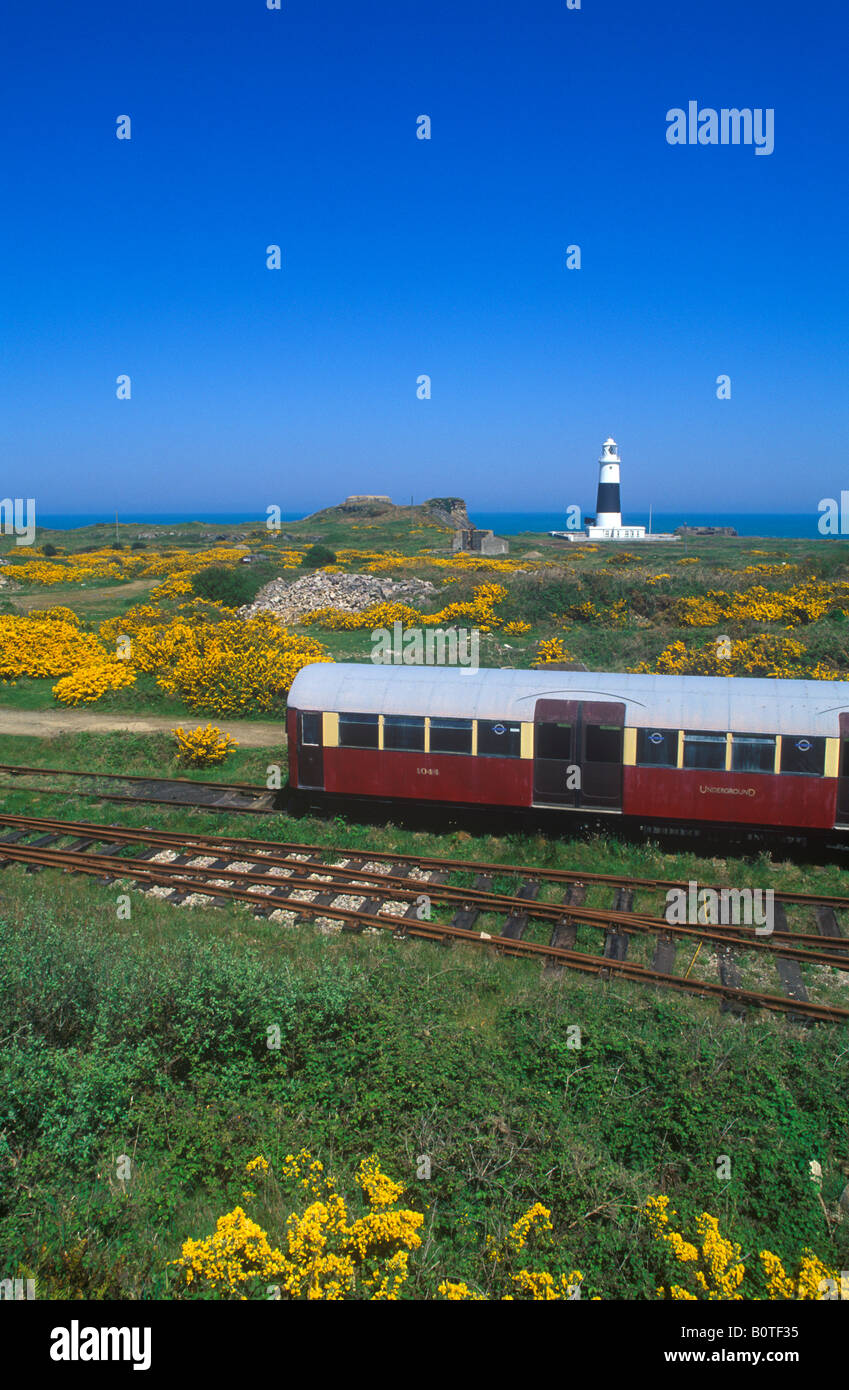 train in front of the lighthouse, Alderney Island Stock Photo