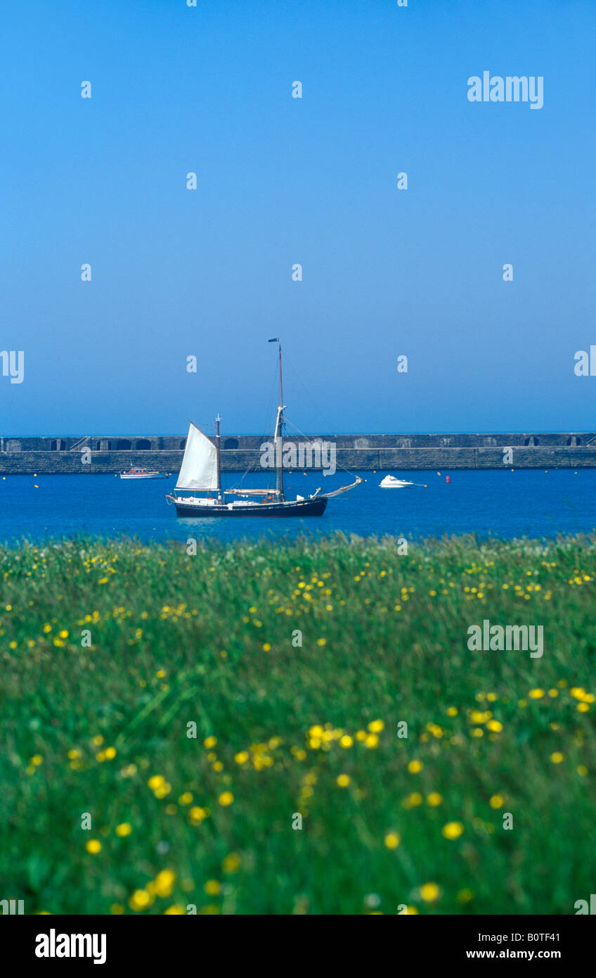 sailing ship at Braye Harbour, Alderney Island Stock Photo