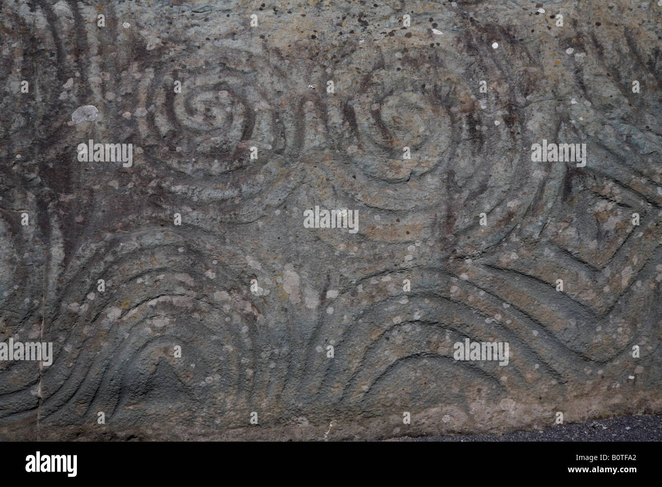 megalithic decorative art spirals on the threshold stone at newgrange , county meath , republic of Ireland Stock Photo