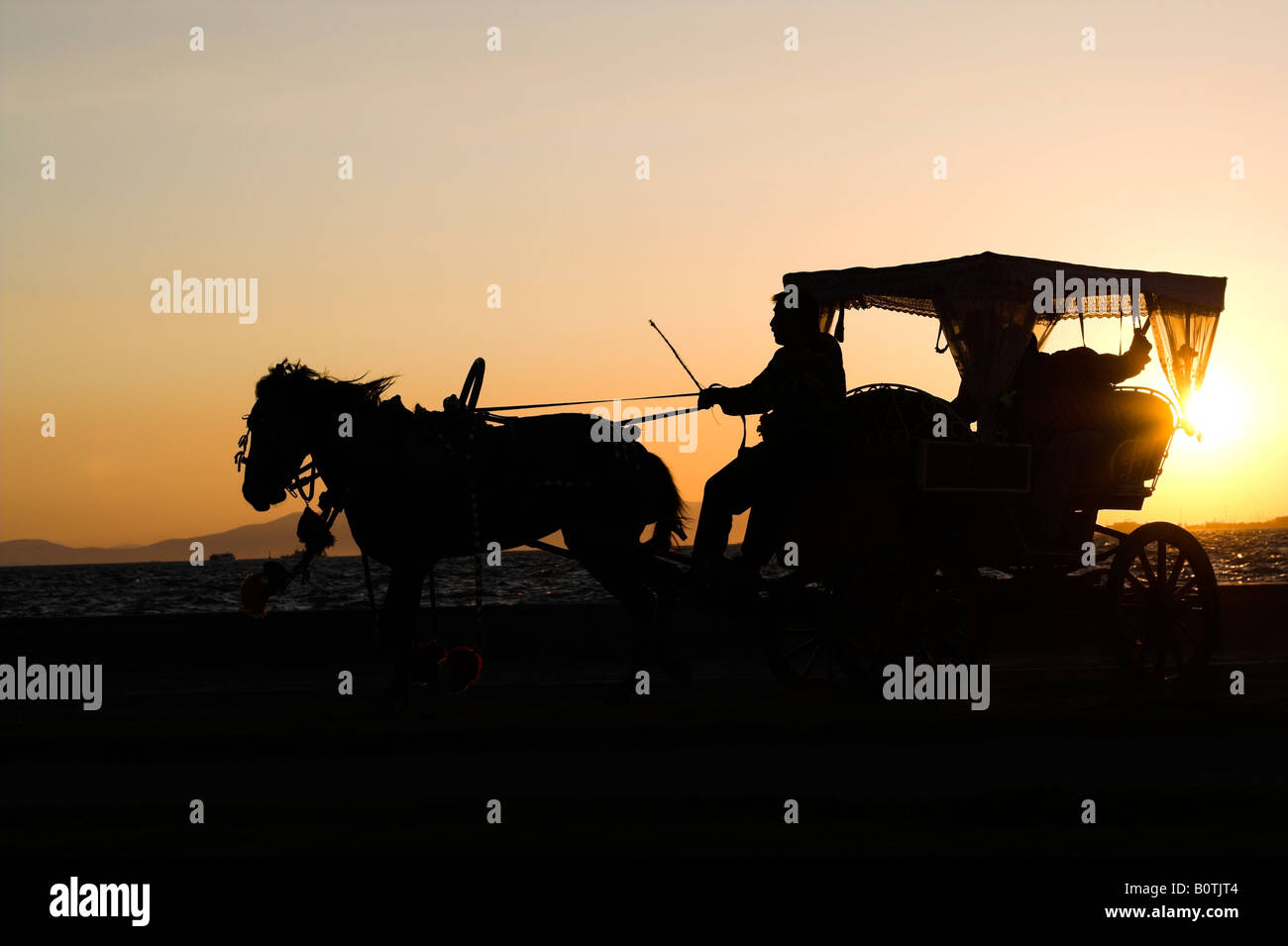 Riding horses at sunset hi-res stock photography and images - Alamy