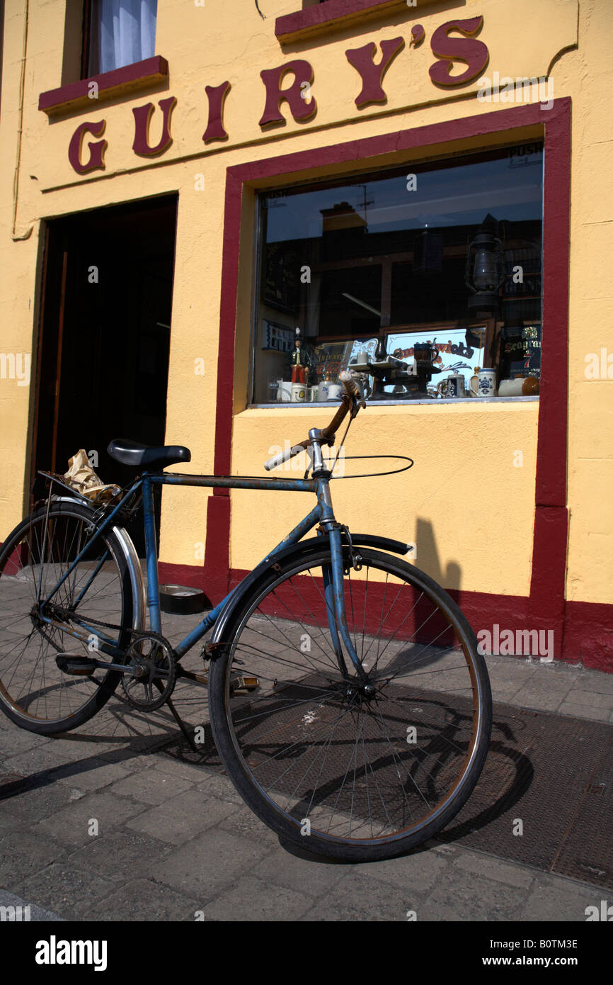 bicycle parked outside guirys irish pub in foxford a traditional small irish town in county mayo republic of ireland Stock Photo