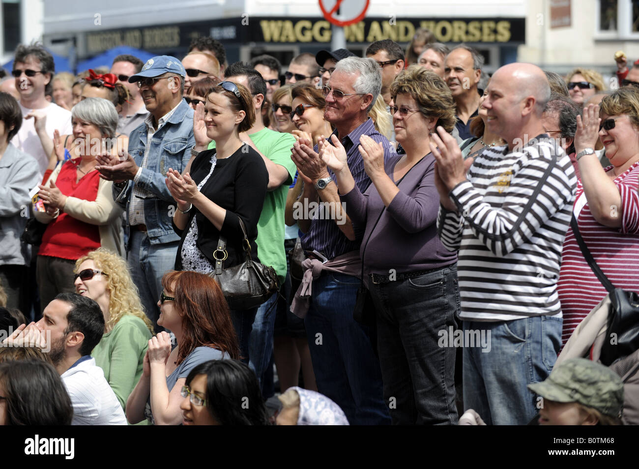 The crowd applaud an act at a Brighton Festival street event May 2008 Stock Photo