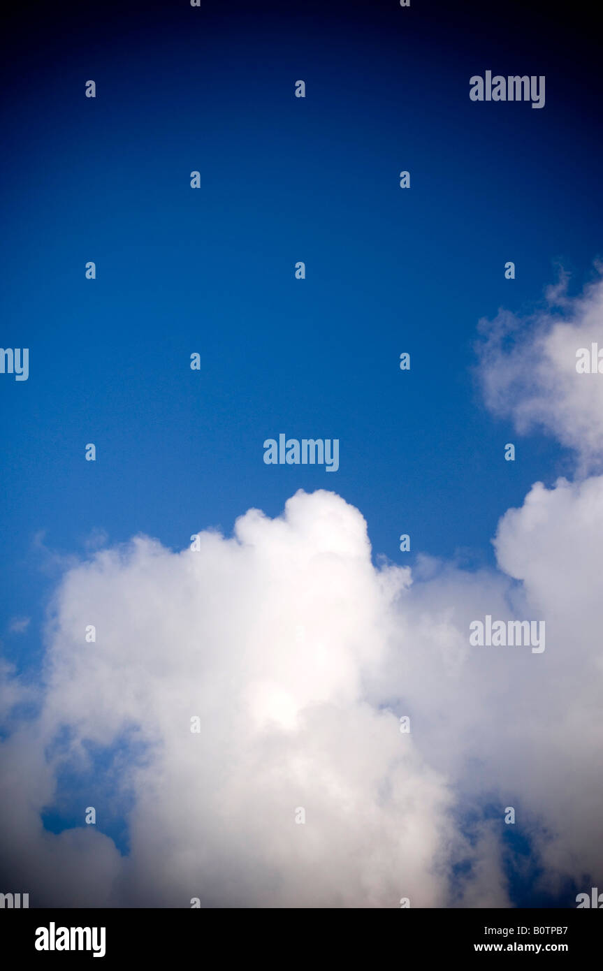 Blue sky and white fluffy clouds Stock Photo - Alamy