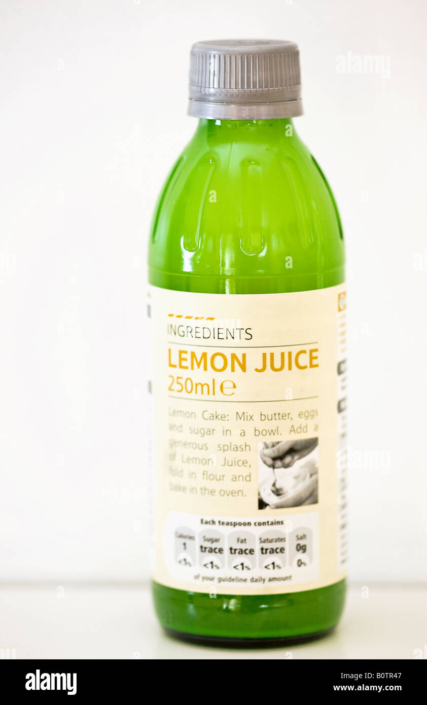 Bottle of lemon juice against a white background Stock Photo Alamy