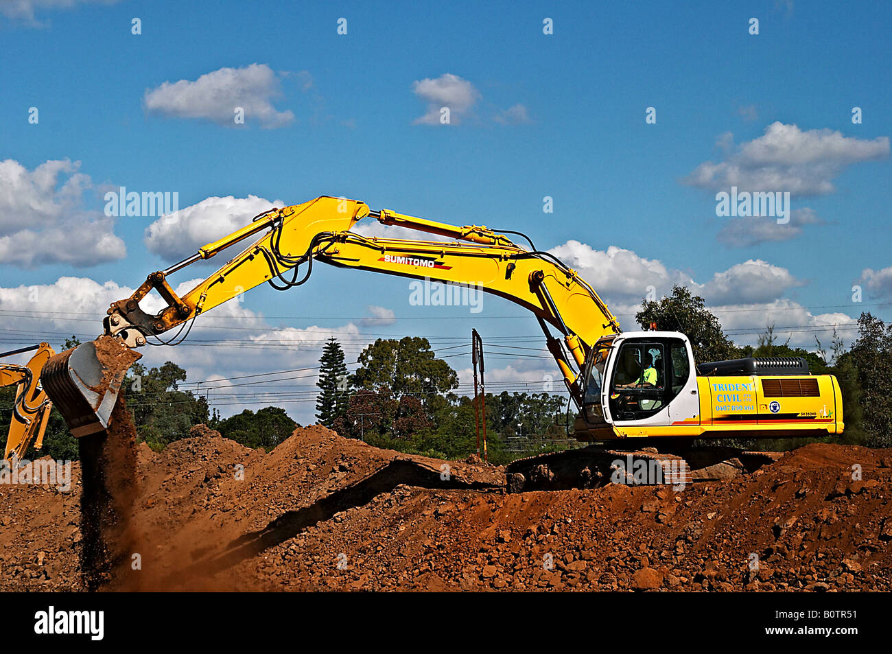 Construction Excavation - Hydraulic Excavator - Backhoe Stock Photo