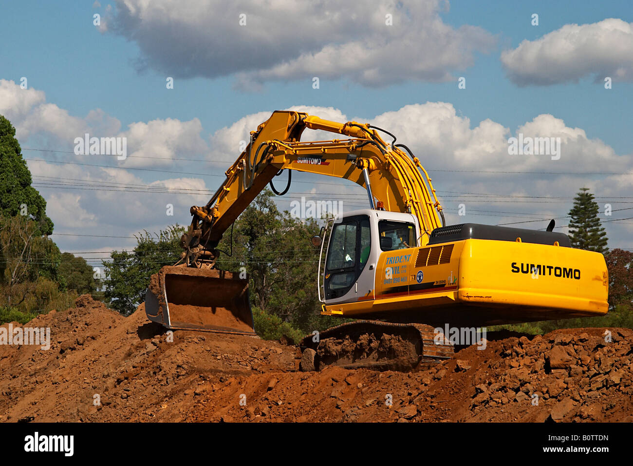 Construction Excavation - Hydraulic Excavator - Backhoe Stock Photo
