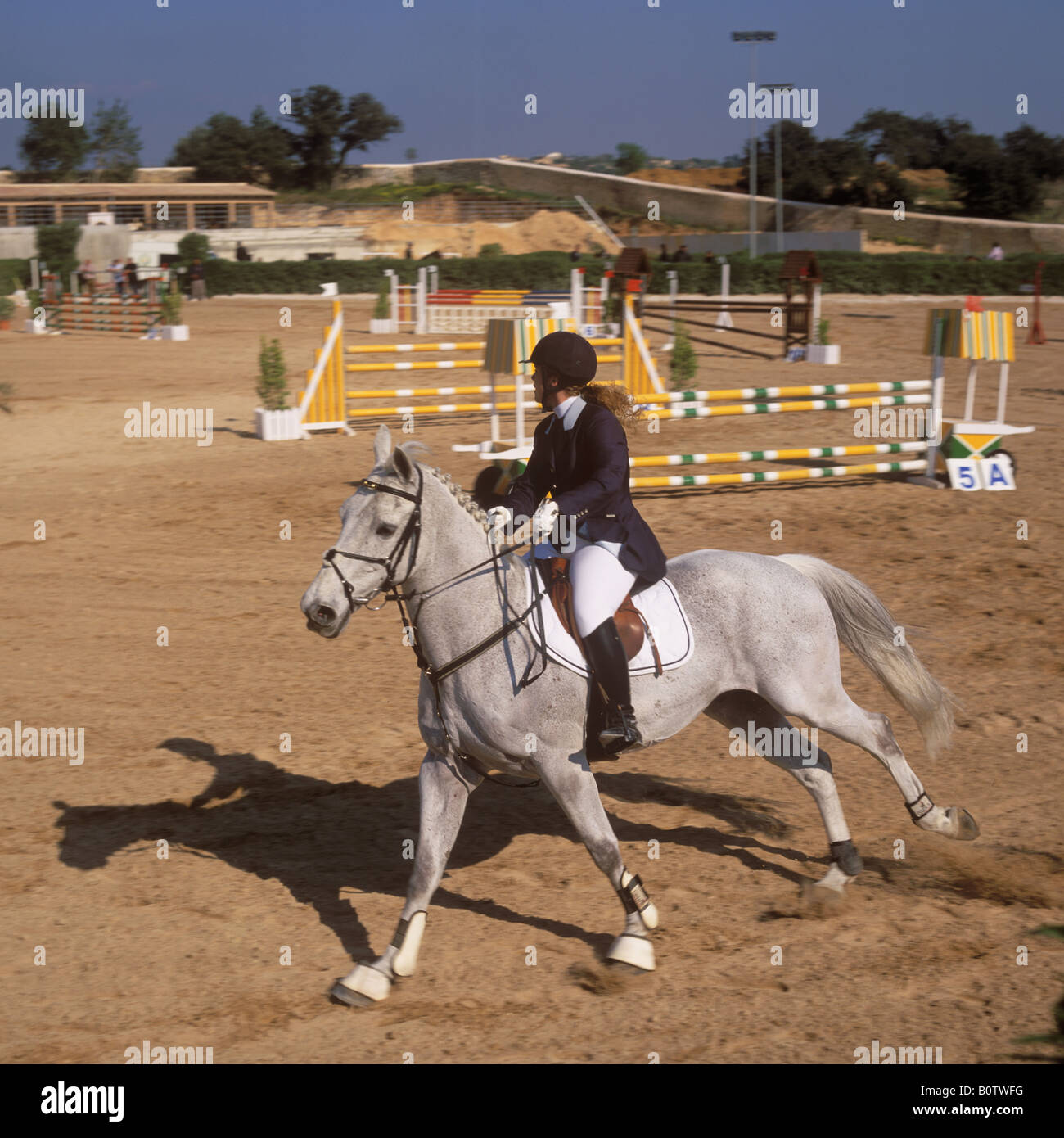 Horse and rider participating in a jumping competition at the Son Gual riding stables, near Palma de Mallorca, Baleares, Spain. Stock Photo