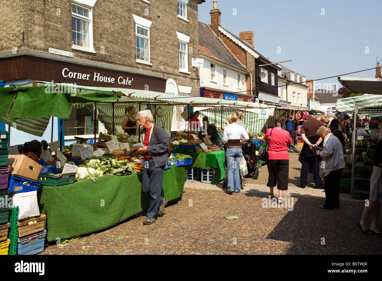 UK England Suffolk Saxmundham weekly market vegetable stall in front of ...