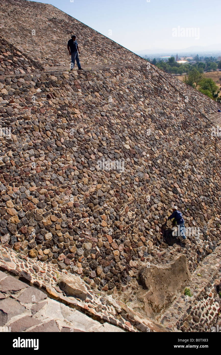 Workmen maintain the Pyramid of the Moon at Teotihuacan Mexico's largest ruin site. Stock Photo