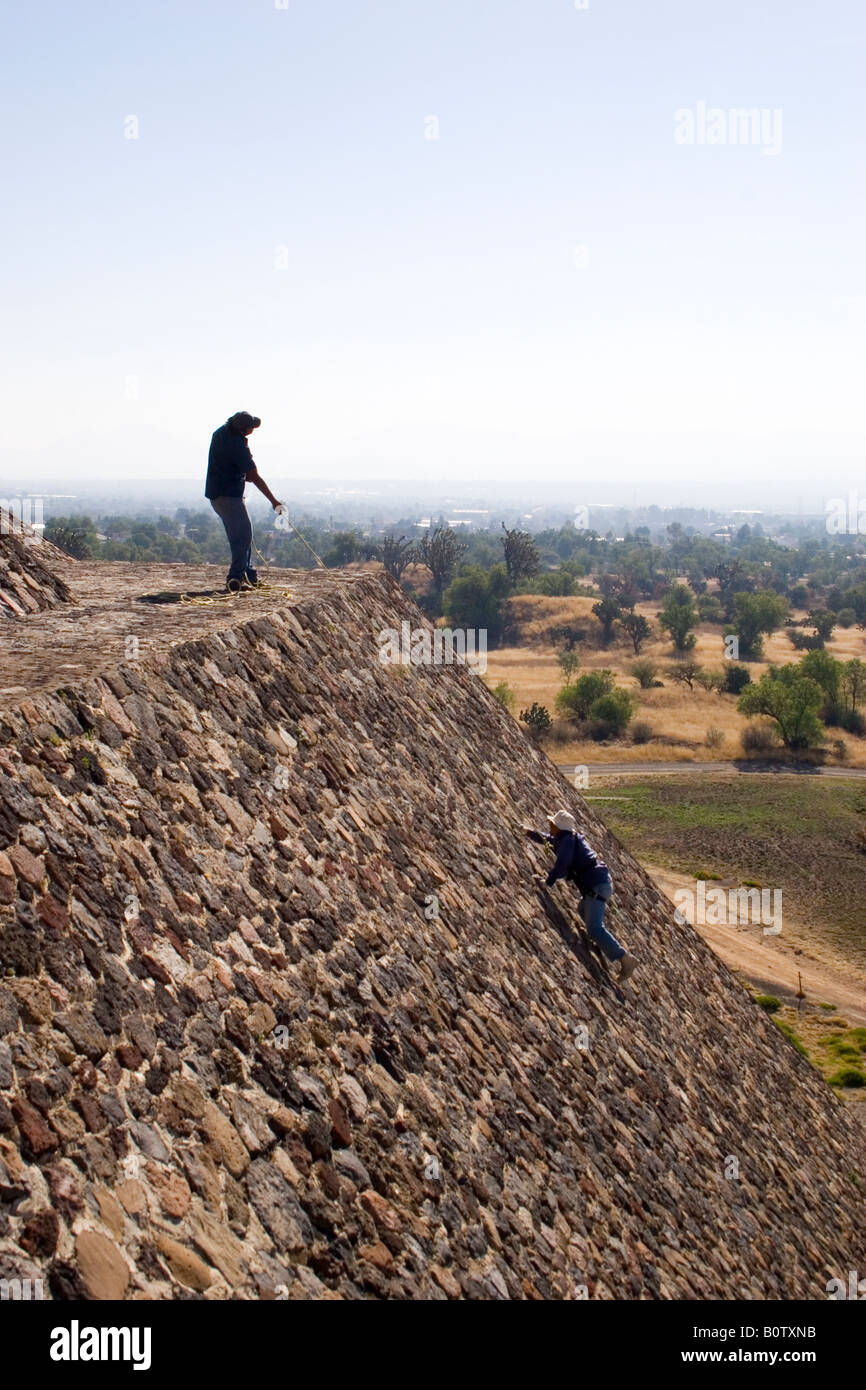 Workmen maintain the Pyramid of the Moon at Teotihuacan, Mexico's largest ruin site. Stock Photo