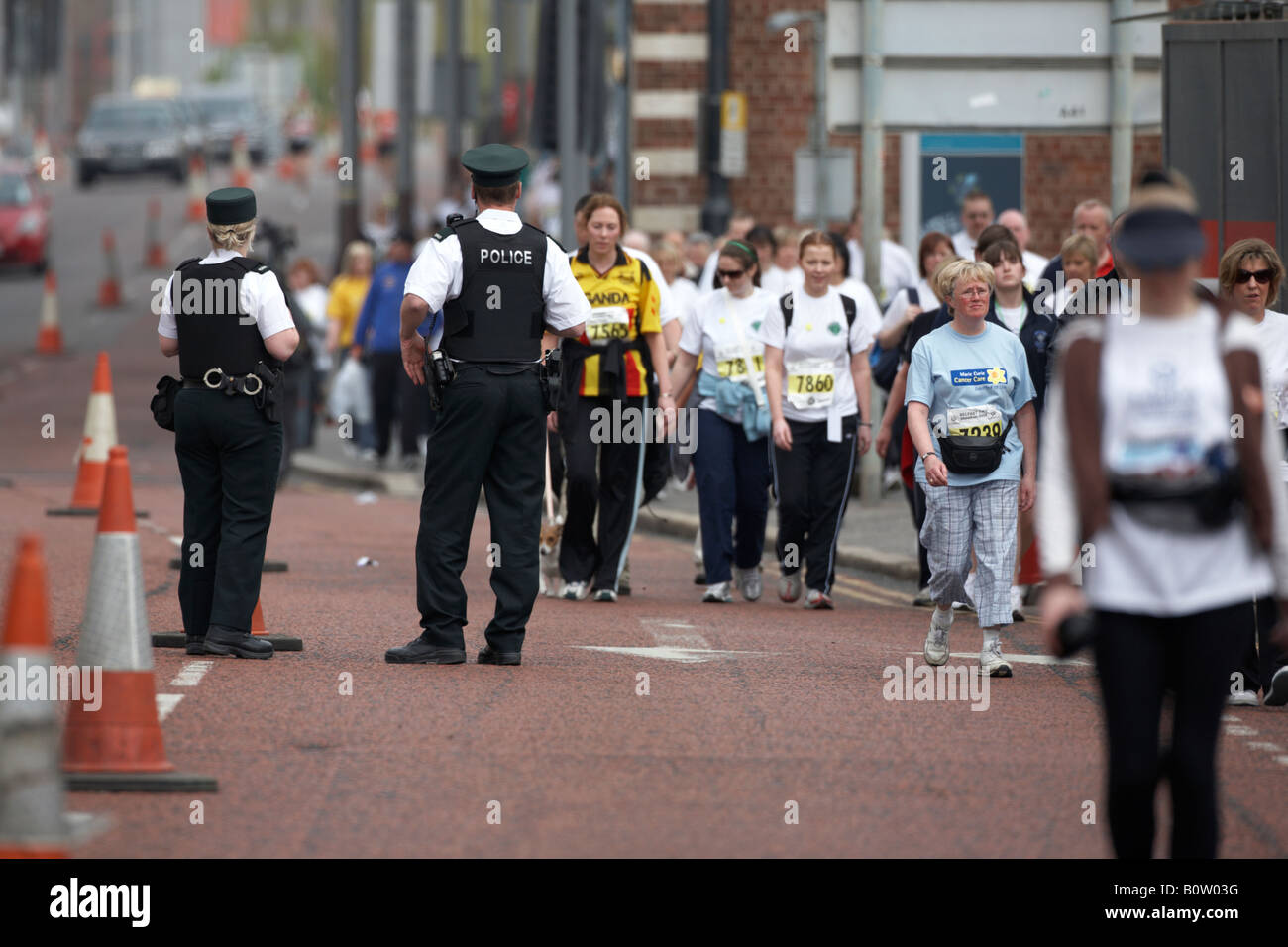 PSNI police service northern ireland officer on patrol directing