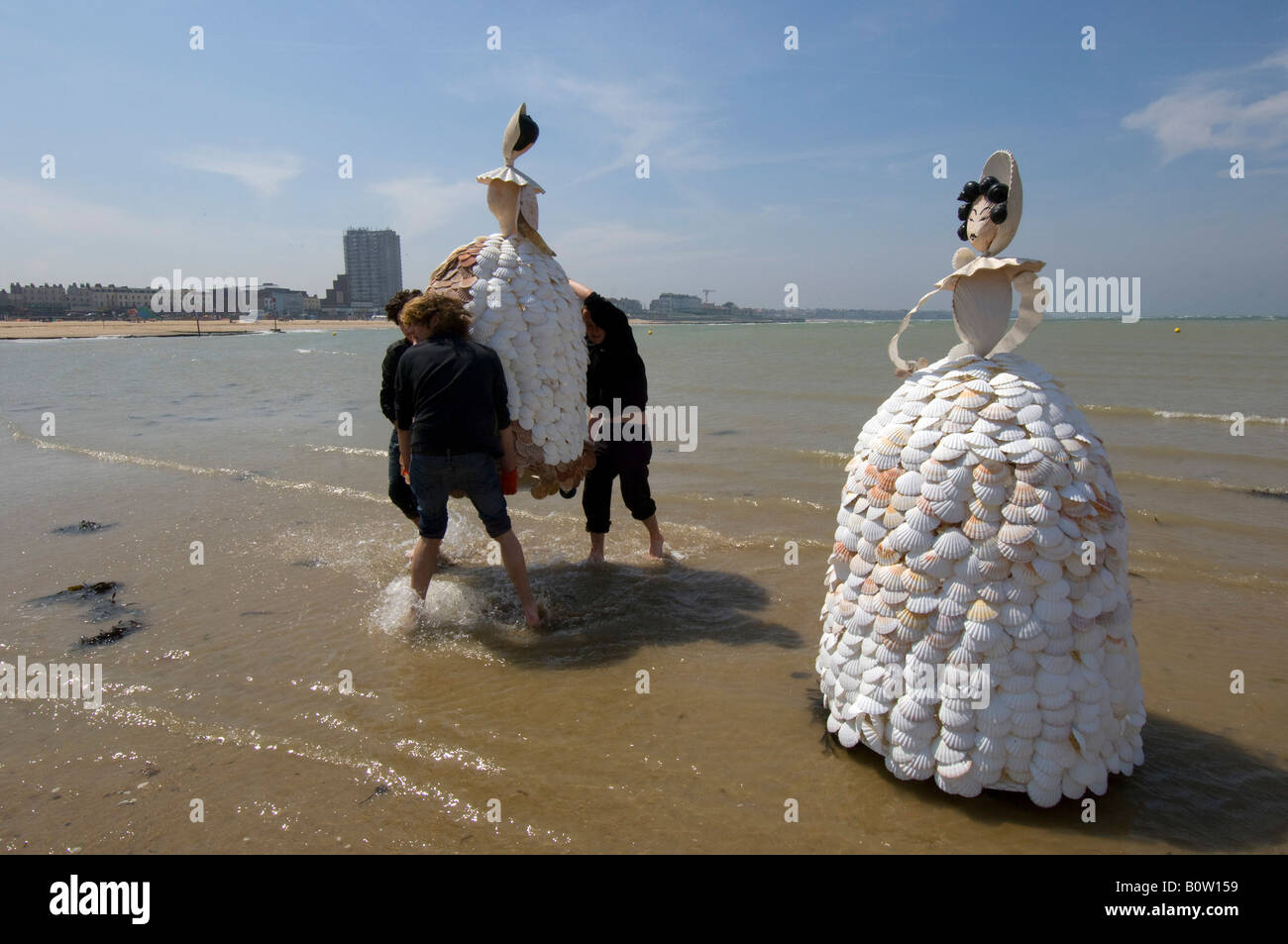 Two 7ft high shell ladies being carried onto Margate Beach Stock Photo