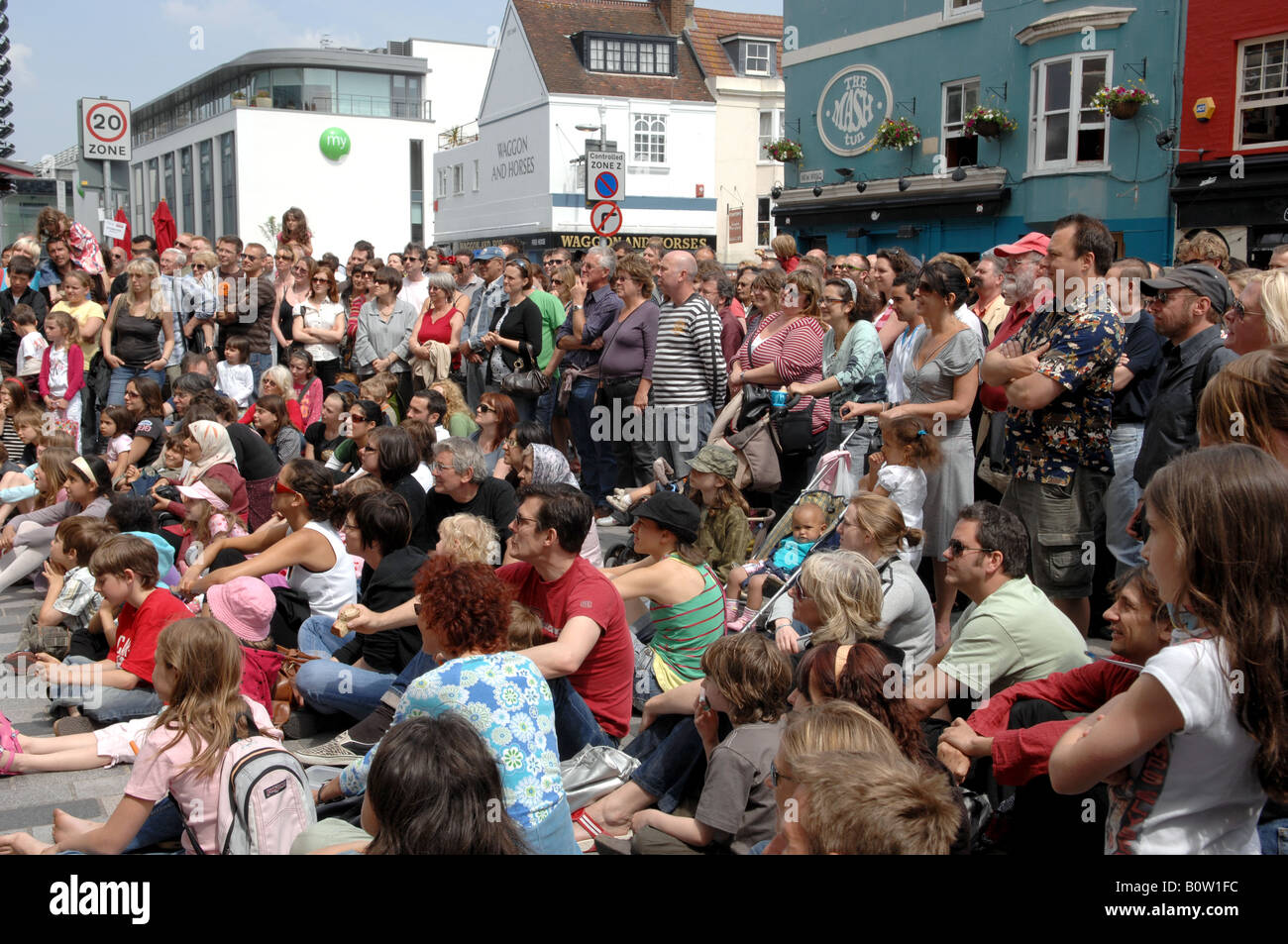 Crowds watch one of the busking acts at this years Brighton Festival May 2008 Stock Photo