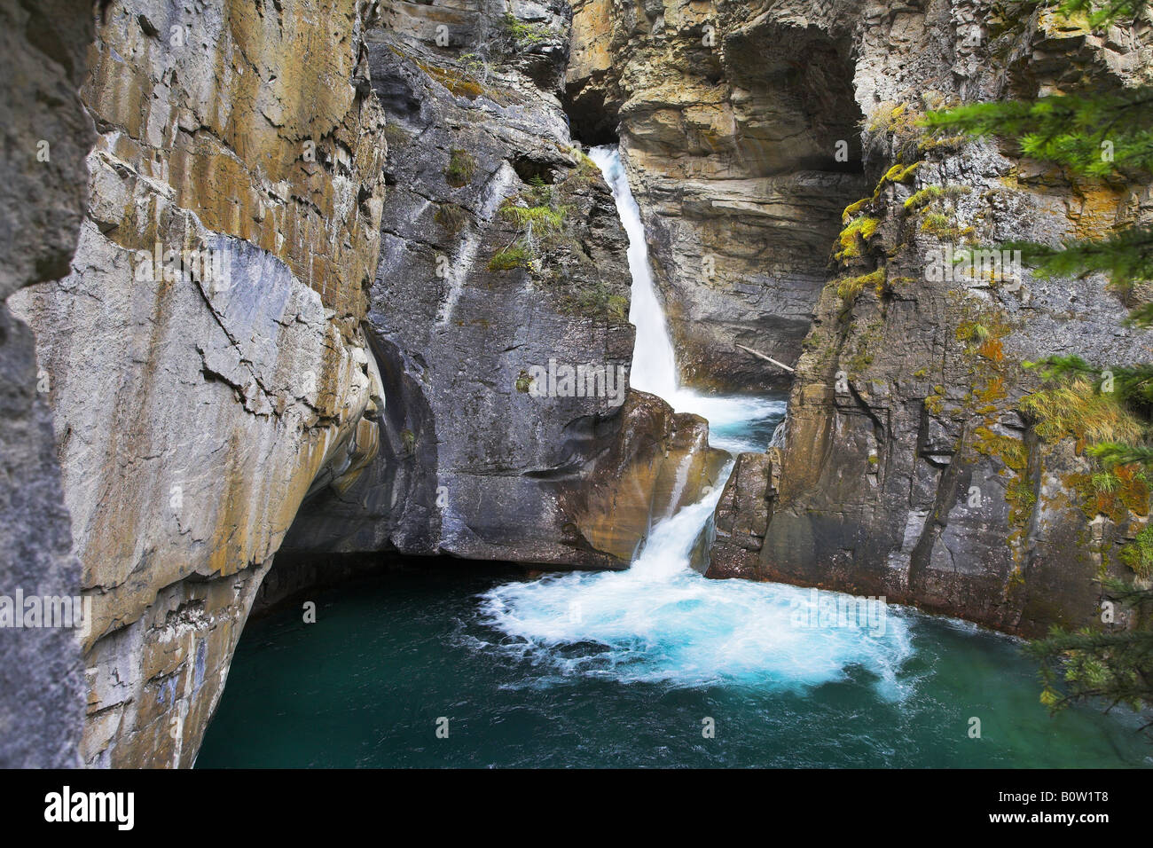 Amazingly beautiful falls with greenish water in woods of Northern Canada Stock Photo