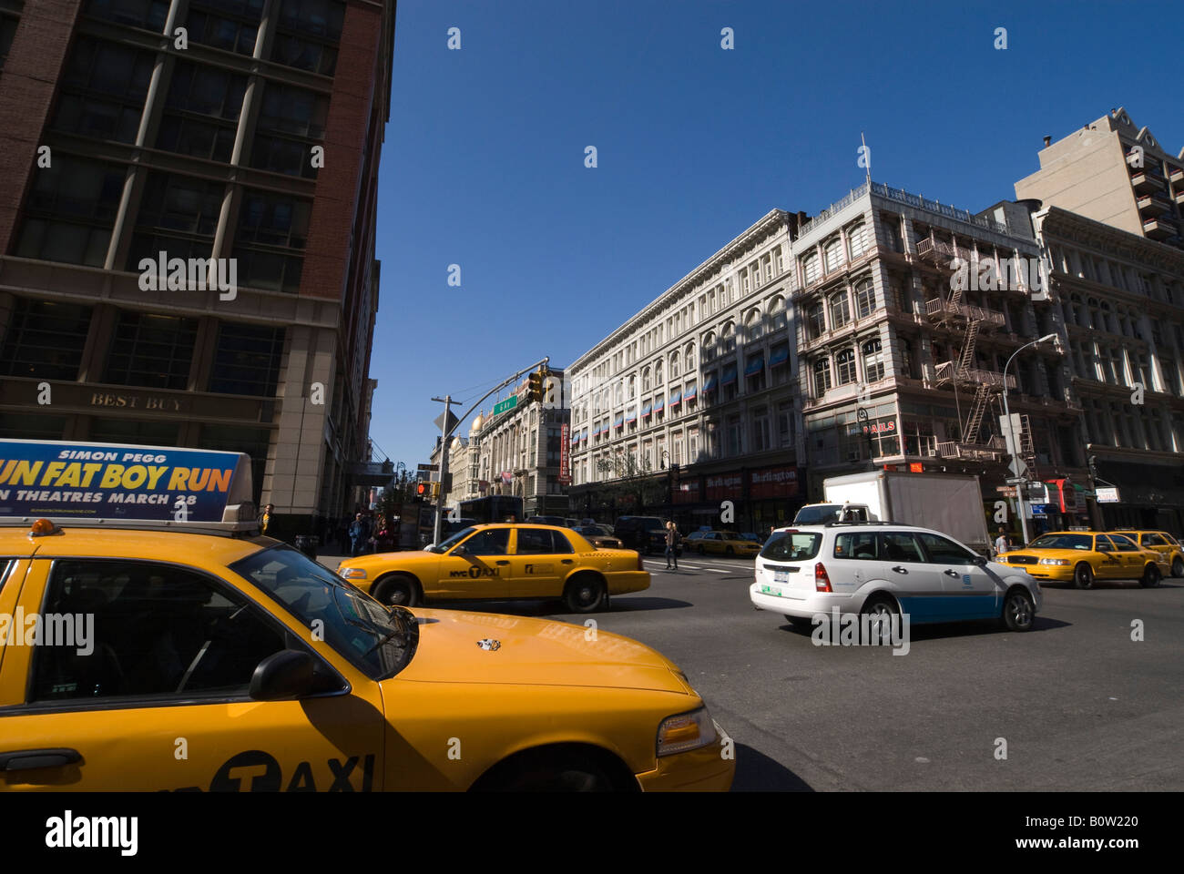 New York city Manhattan island street scene with yellow taxi Stock