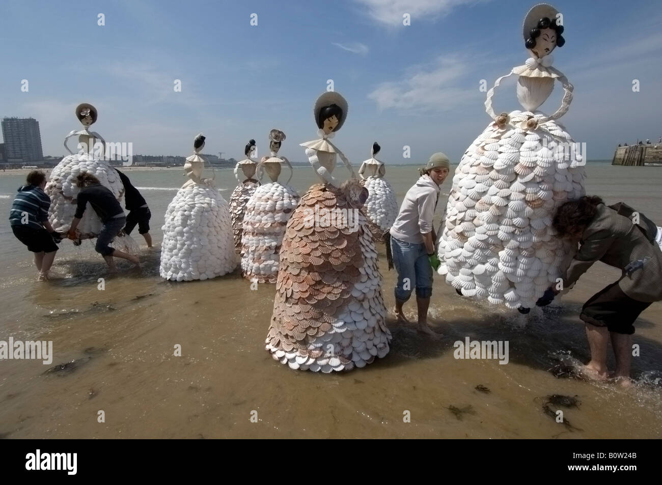 A group of 7ft high shell ladies being carried onto Margate Beach Stock Photo