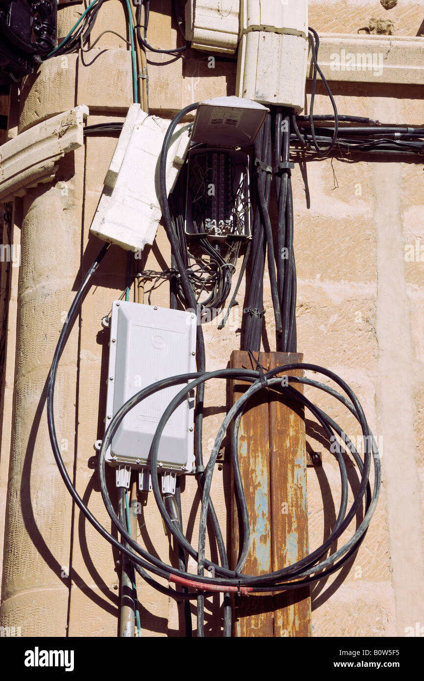 Mess of electrical wiring and open connection box in Baeza Jaen