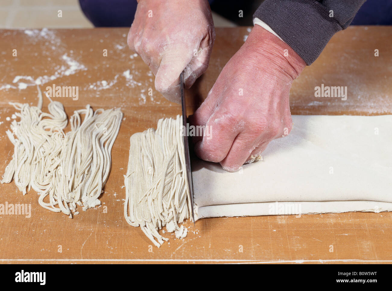 Person making buckwheat noodle Stock Photo