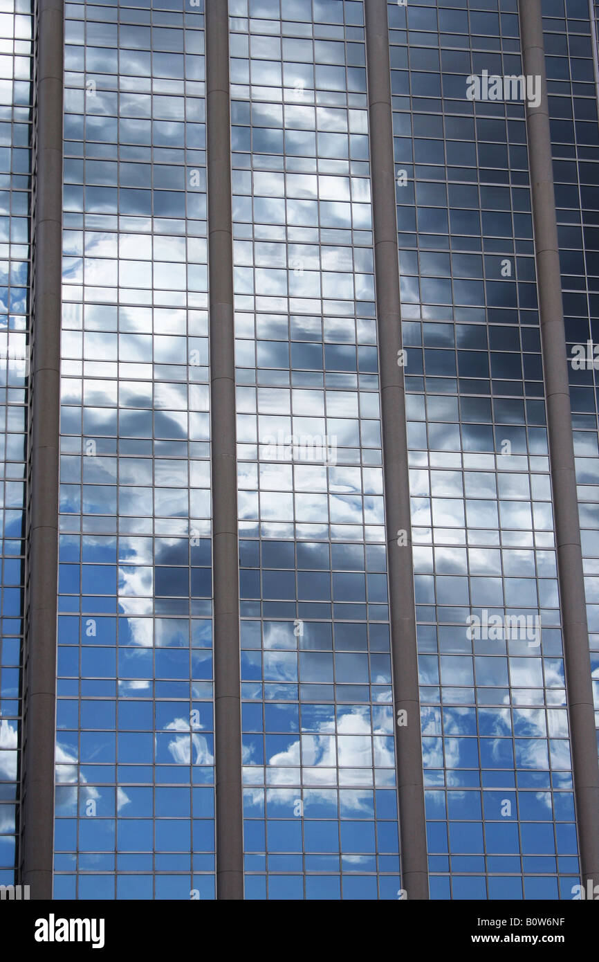Cloudy sky reflected in glass business tower Stock Photo - Alamy