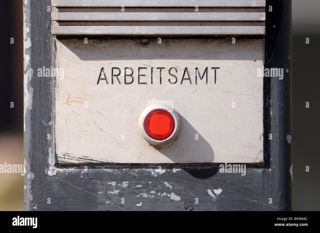 Red doorbell button, 'Arbeitsamt' (employment agency) in writing Stock Photo