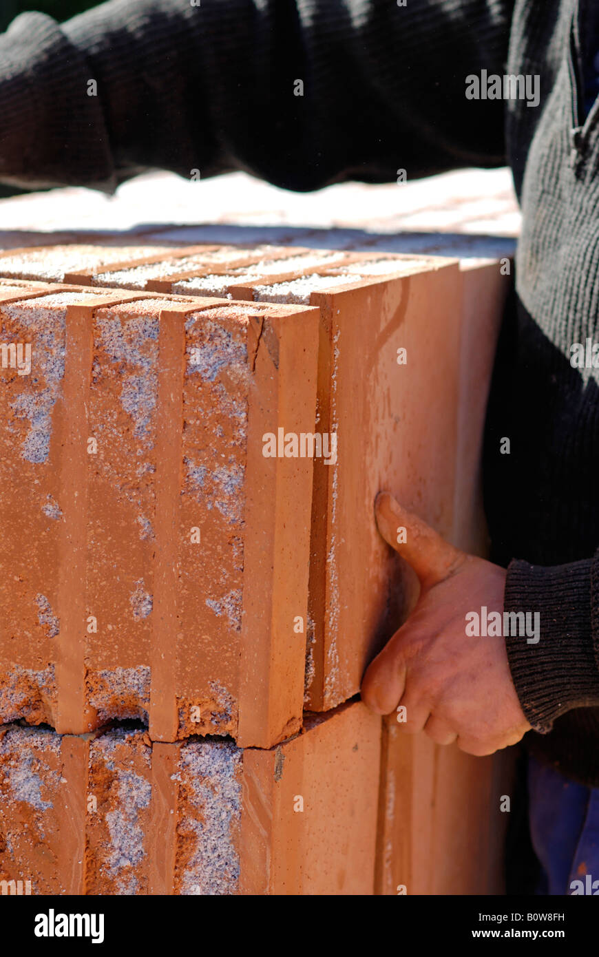 Laying bricks at a building site for a private home Stock Photo