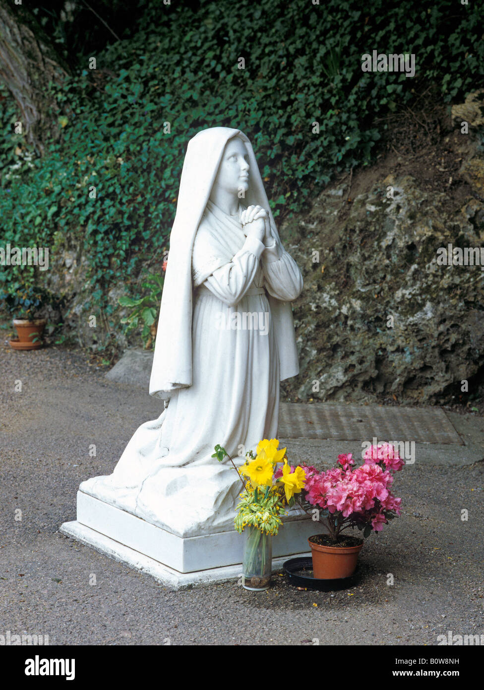 Statue of St. Bernadette of Lourdes in a Lourdes grotto, St. Gildard