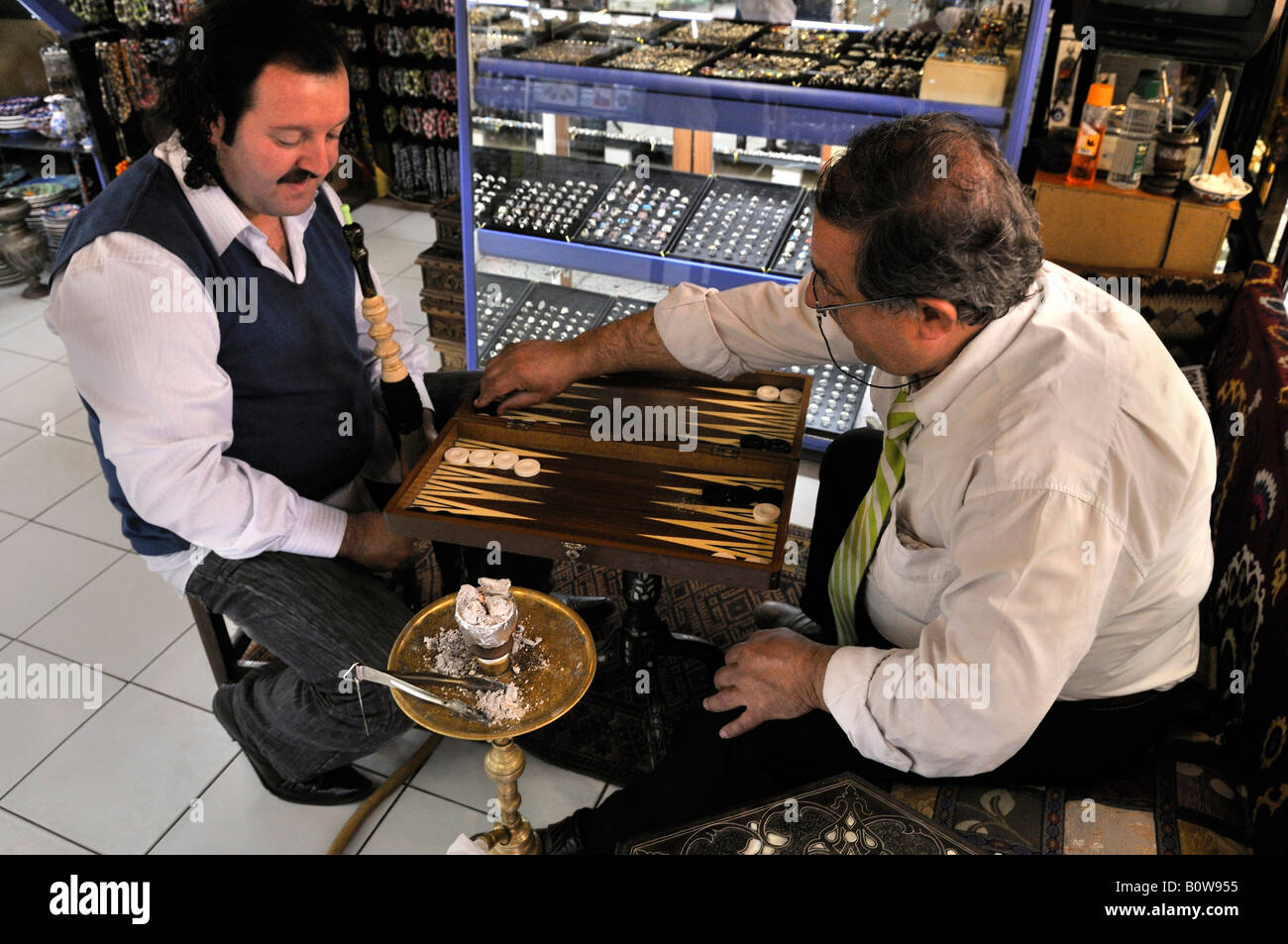 Men smoking hookah or shisha while playing backgammon, Istanbul, Turkey ...