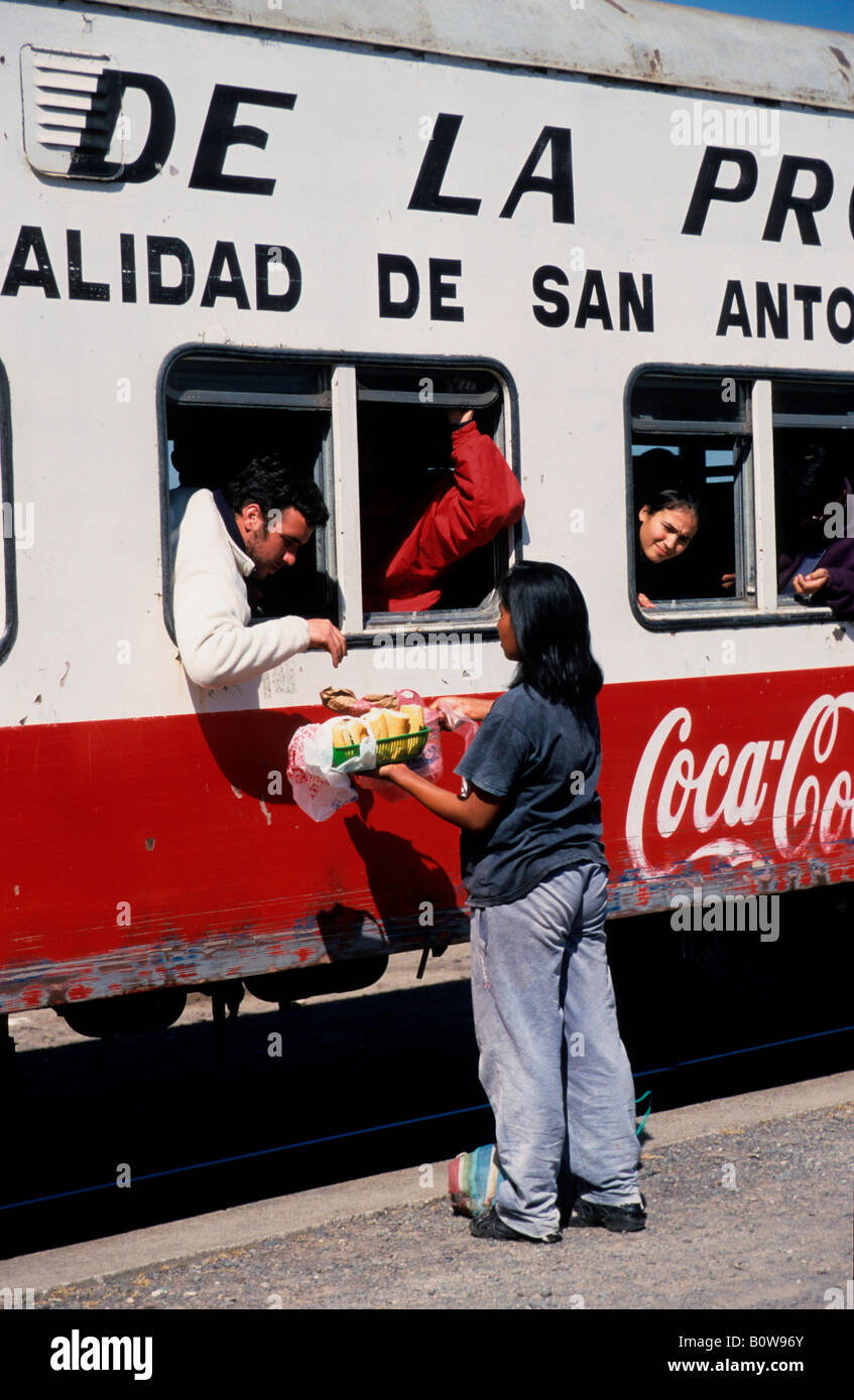 Saleswoman in front of carriage, Tren a las Nubes, Cloud Train car, Salta Province, Argentina Stock Photo