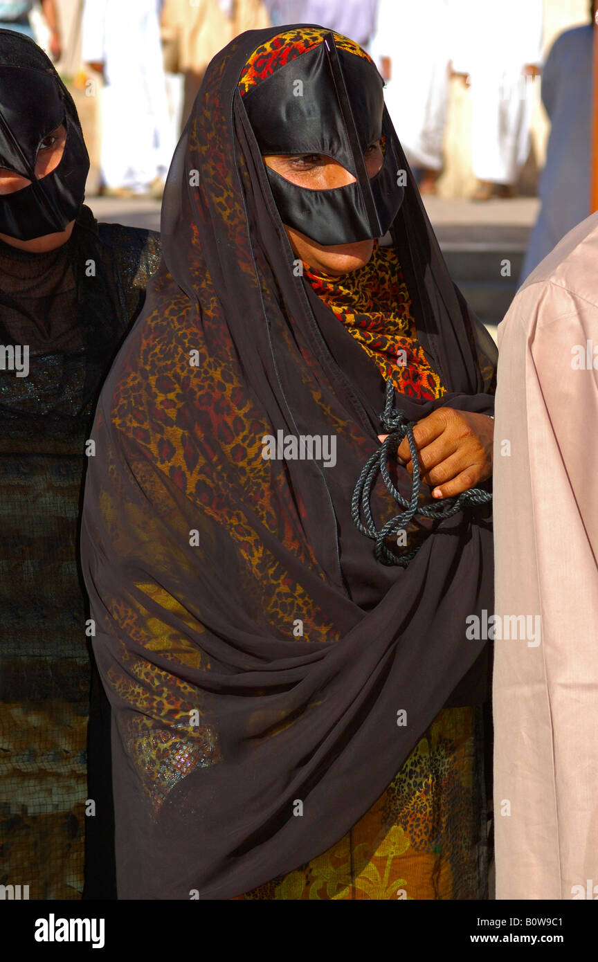 Omani woman wearing a face veil, chador, Nizwa, Oman, Middle East Stock Photo