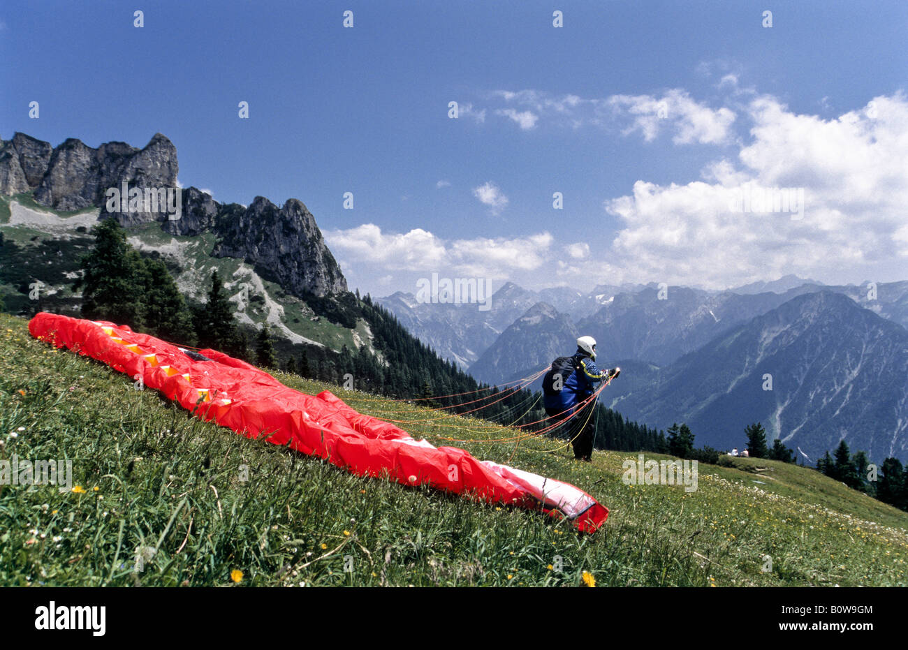 Paraglider preparing for takeoff, Rofan Mountains, Alps, Schwaz, Tirol, Austria, Europe Stock Photo