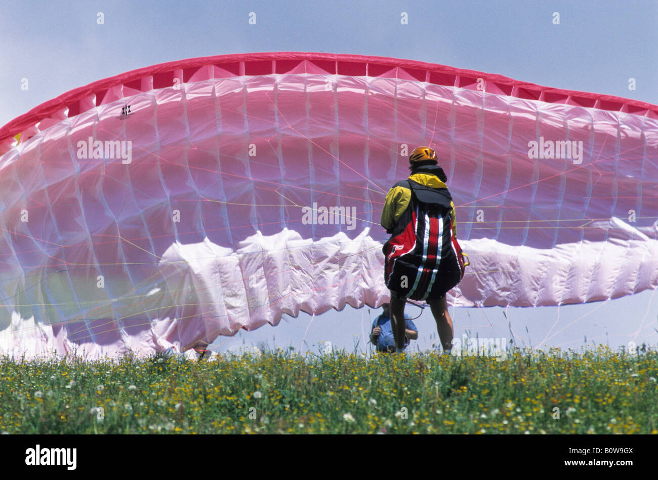 Paraglider preparing for takeoff, Rofan Range, Alps, Schwaz, Tirol, Austria, Europe Stock Photo