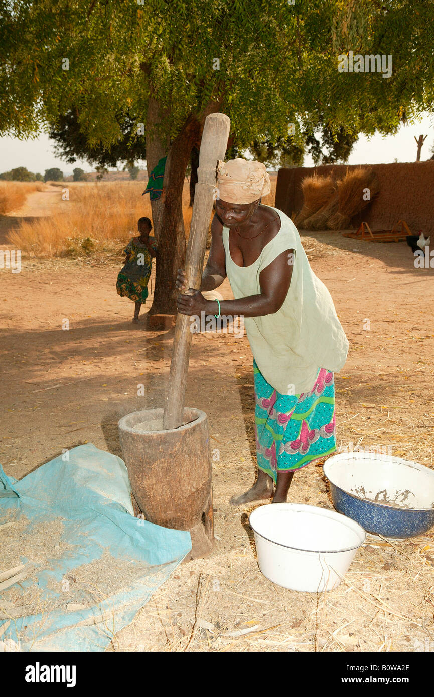Woman pounding millet, Houssere Faourou, Cameroon, Africa Stock Photo