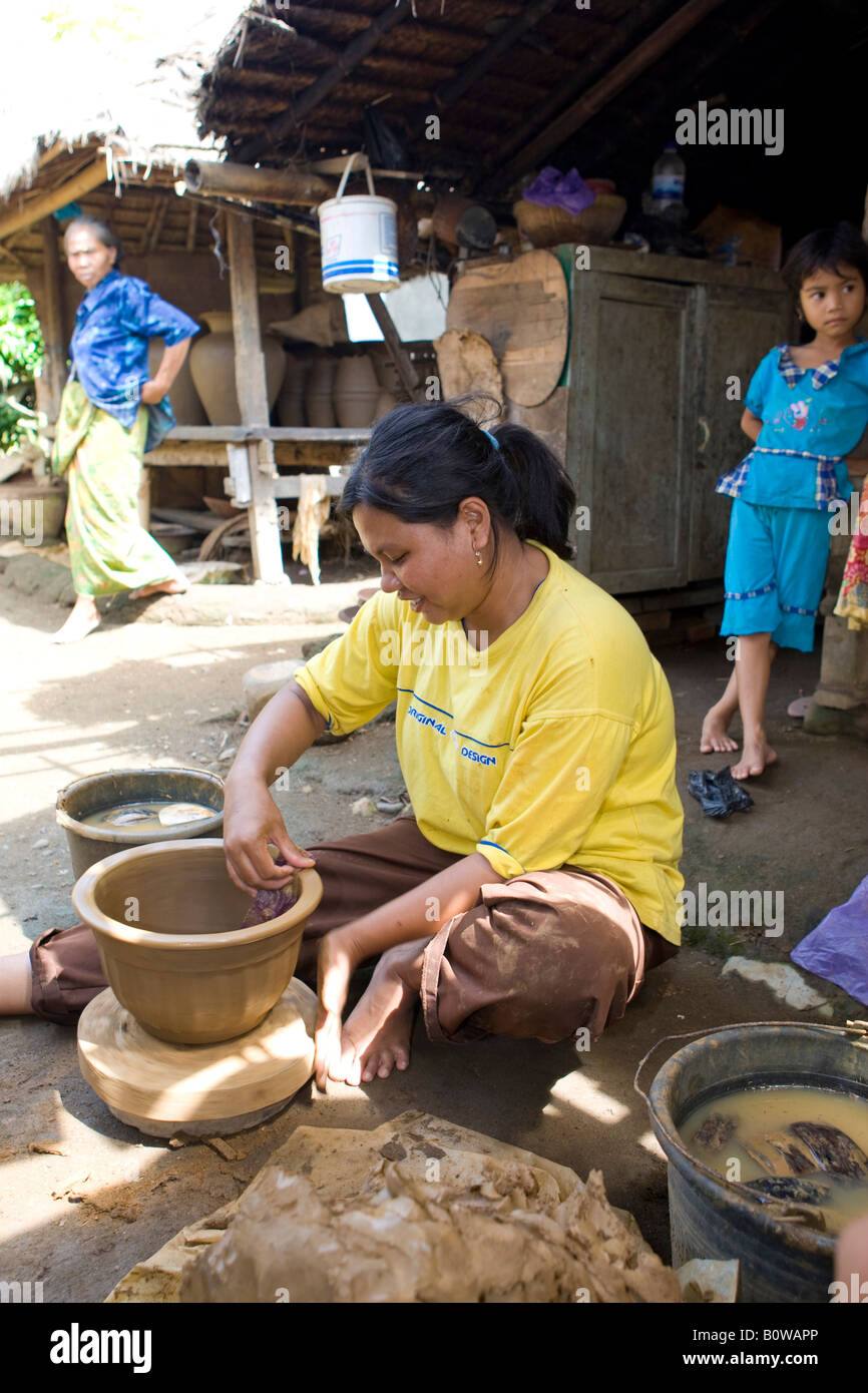 Woman crafting a clay jar in the traditional method, Banyumulek, Lombok Island, Lesser Sunda Islands, Indonesia Stock Photo