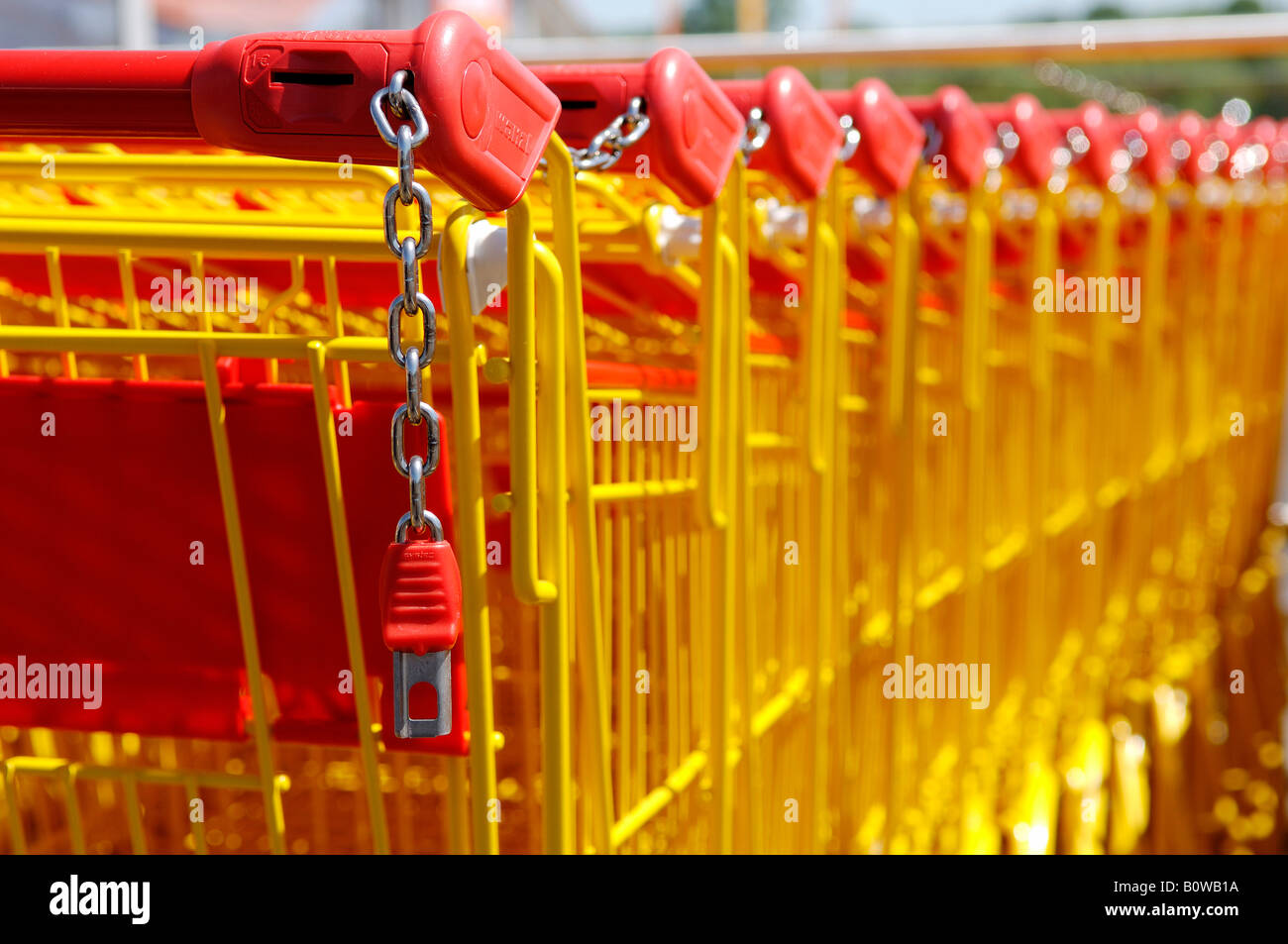Yellow and red shopping carts in front of a supermarket, Graefenberg, Middle Franconia, Bavaria, Germany, Europe Stock Photo